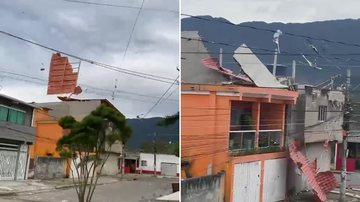 Telhado voa e cai em cima de outra casa devido aos fortes ventos, em Bertioga