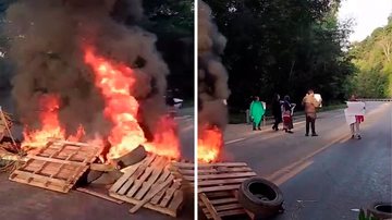 Moradores em protesto na rodovia Rio-Santos, com queima de madeiras e pneus
