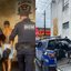 Imagem mostra dois agentes da GCM conduzindo suspeito para a delegacia