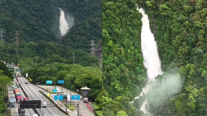 A imagem mostra a Cachoeira do Paraíso com um grande volume de água, avistada por motoristas na subida da Rodovia Anchieta, na região da Serra do Mar, em Cubatão (SP)