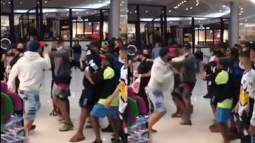 'Porradaria' vira moda e entretenimento em shopping de Praia Grande Dois homens brigando e pessoas observando - Reprodução