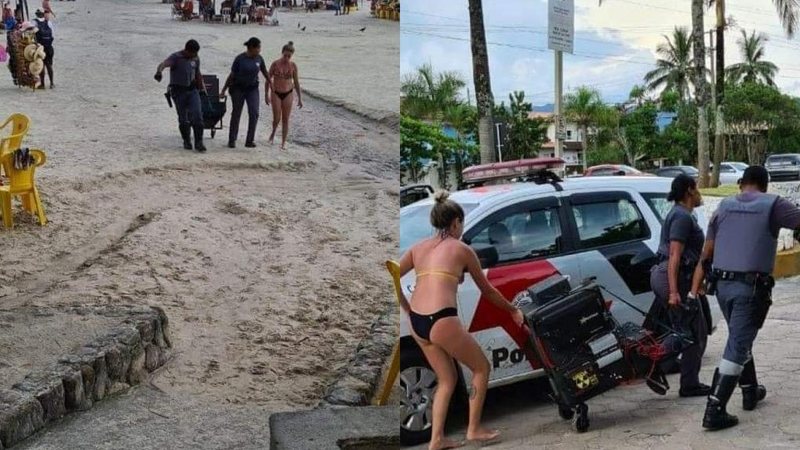 Lei do silêncio segue dividindo opinições em Ubatuba Capa - Lei do silêncio em Ubatuba completa um ano e segue dividindo opiniões Mulher na praia tendo som apreendido por policiais - Imagem: Reprodução / Kauai Ubatuba