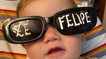 Em 18 horas após a postagem da foto na rede social, o cantor já havia recebido mais de 4.300 comentários e quase 1.300.000 “likes” Cantor Zé Felipe posta foto da filha e encanta a internet Foto da bebê com o óculos de sol - Reprodução Instagram