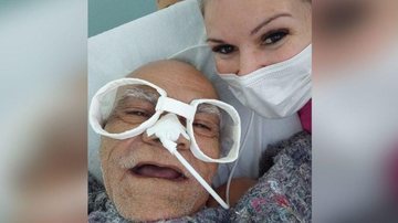 Idoso levou na brincadeira e adorou o novo óculos confeccionado pela enfermeira Enfermeira e paciente Enfermeira com máscara de proteção ao lado do idoso com os óculos de papel - Reprodução