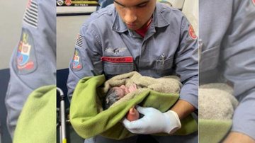 Um dos soldados que ajudou no pós-parto de um recém-nascido em São Paulo Soldado com neném no colo Soldado com uma neném no colo enrolada na coberta no pós-parto - Divulgação
