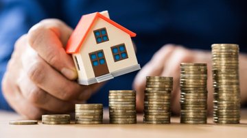 Nova data limite para a regularização dos débitos é 19 de novembro Está com IPTU atrasado em Bertioga? Prazo de regularização é prorrogado Casa e moedas - Imagem: Reprodução /pagbank