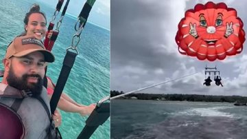 Casal decidiu andar de paraquedas e a tempestade atrapalhou a diversão de ambos Casal de paraquedas Casal de paraquedas à esquerda e paraquedas vermelho à direita - Divulgação