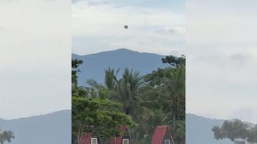 Flagrante aconteceu na manhã de domingo (5) Bertioga: vídeo flagra enorme balão caindo no bairro Rio da Praia Balão cai em bairro de Bertioga - Reprodução